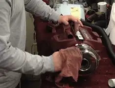 Vacuum repair technician cleaning and servicing a vacuum motor in Boise, ID